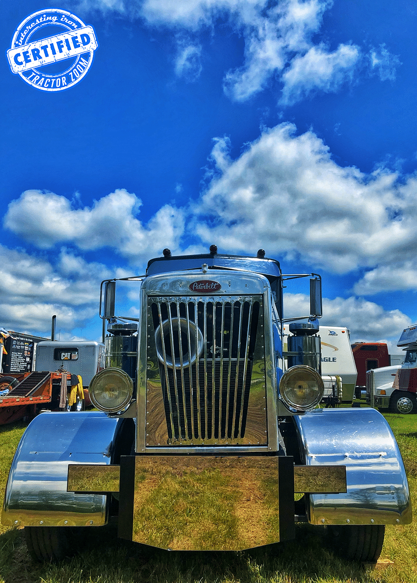 A low angle photo of the nose of a Peterbilt 351 on a sunny summer day