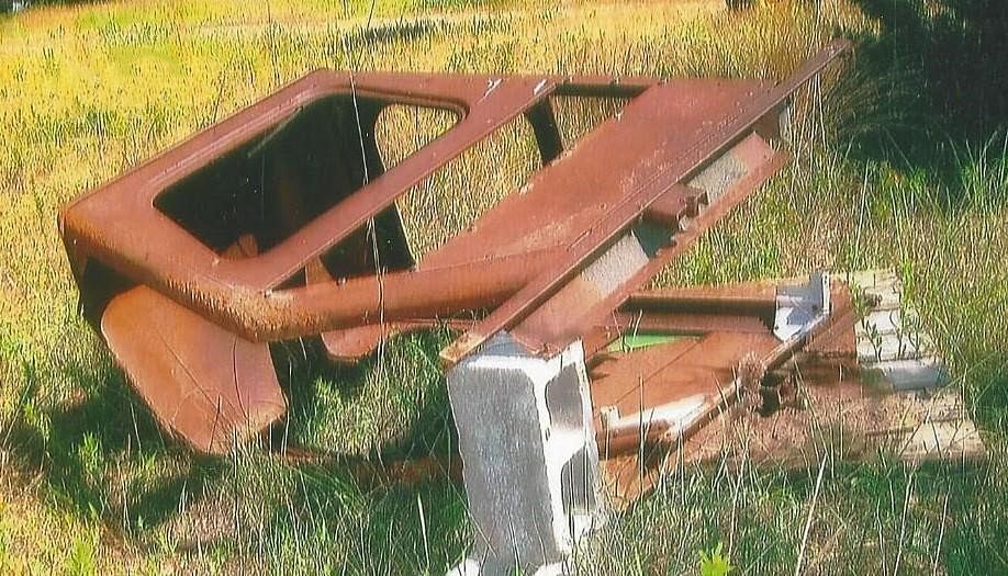 tokheim tractor cab laying on the ground