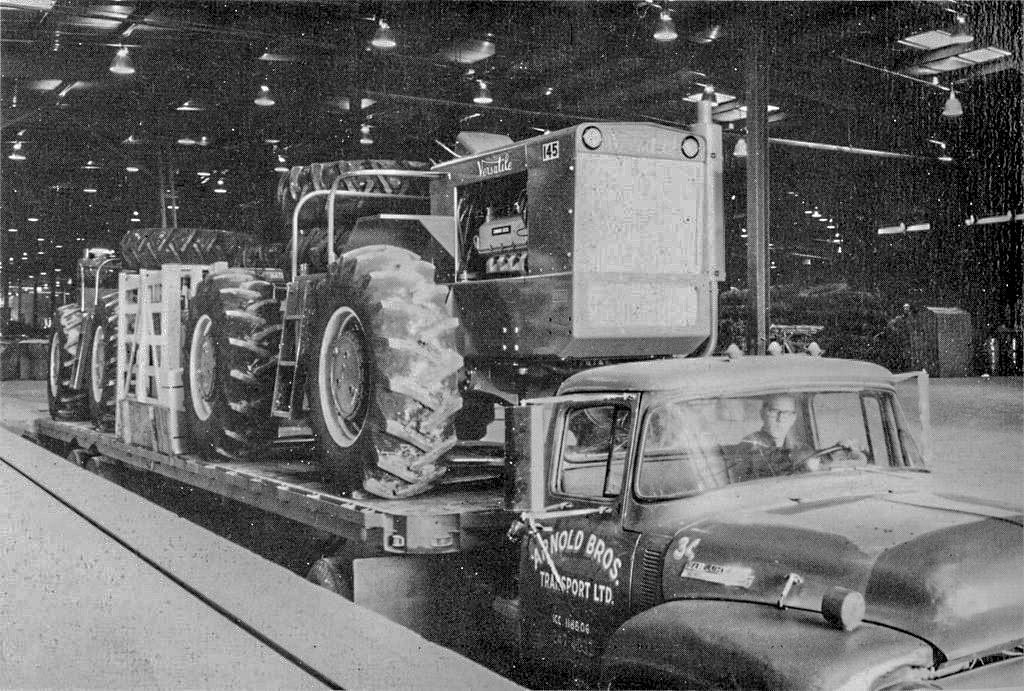 black and white photo of a versatile 145 tractor leaving the factory
