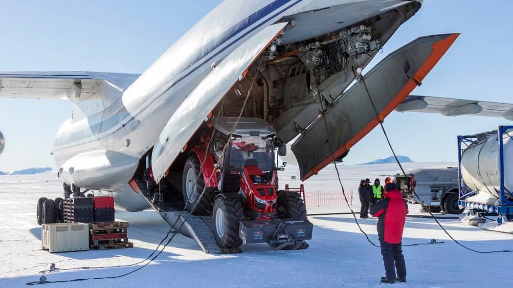 tractor girl's Massey Ferguson 5610 unloading from airplane on antarctica