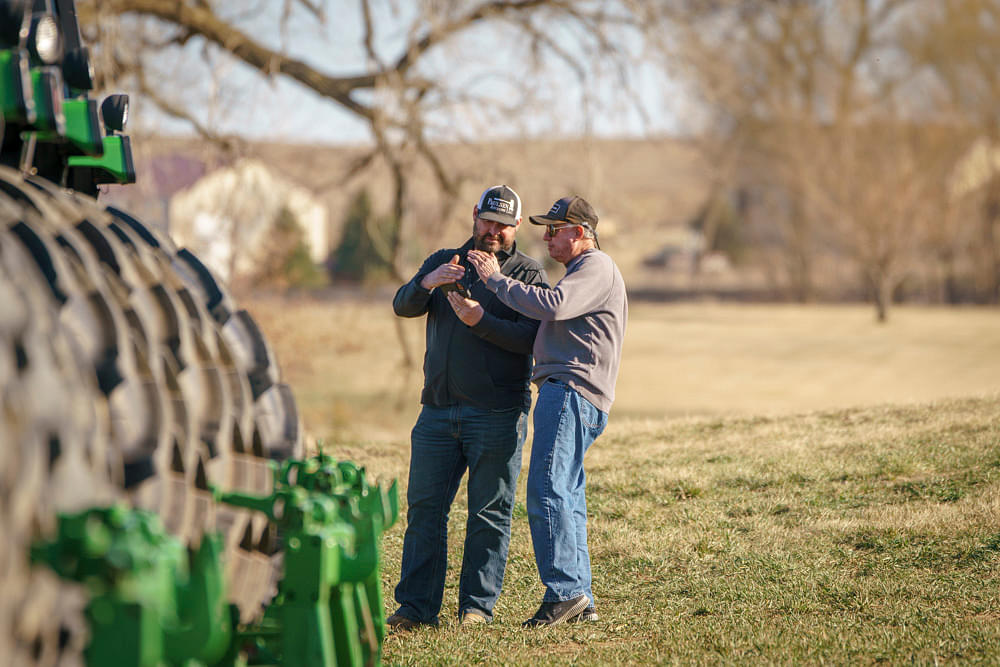 Paulsen Auction LLC auctioneer working with a customer