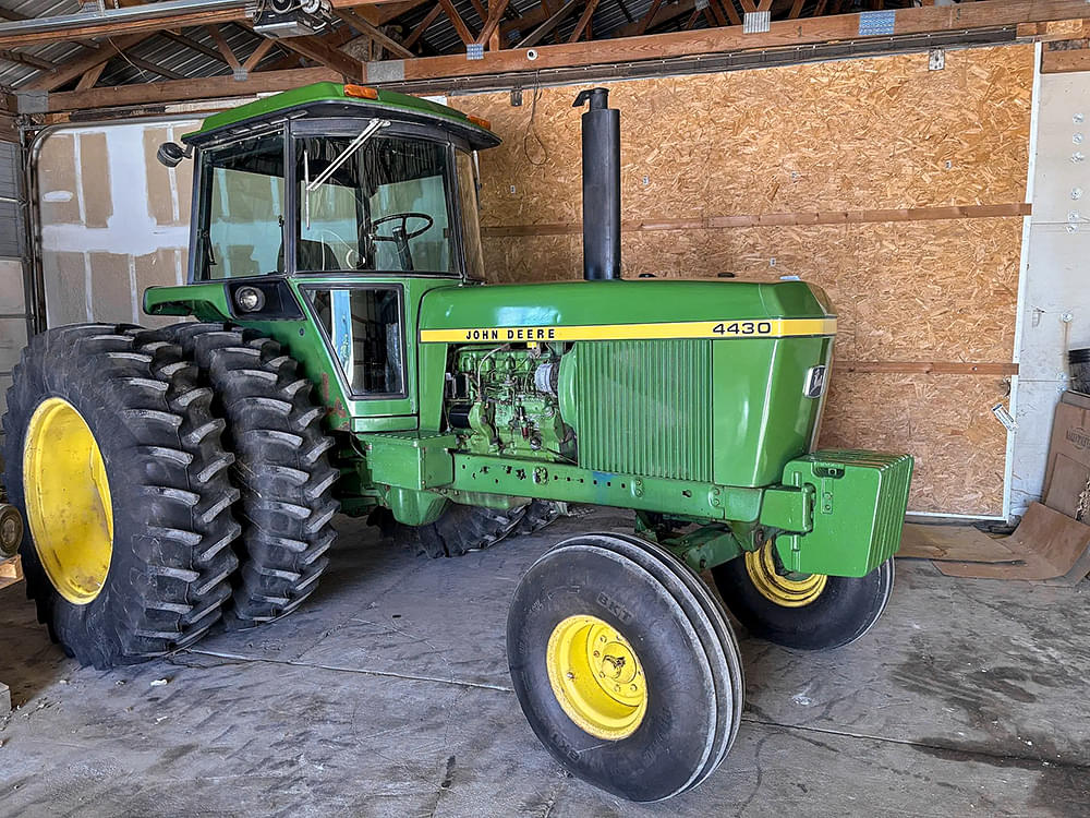John Deere 4430 at a farm equipment retirement auction in Iowa