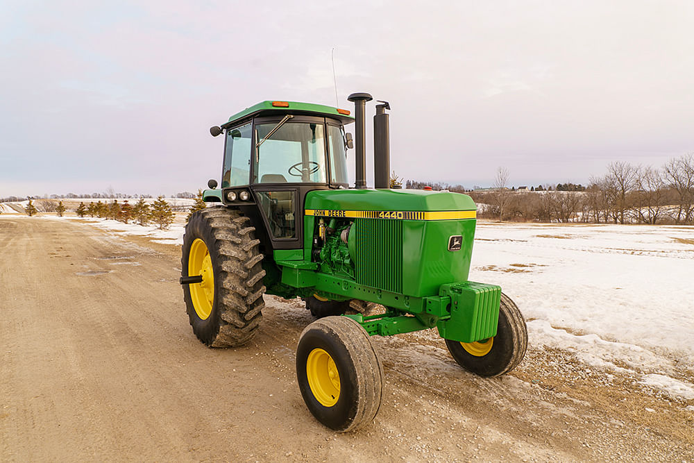 John Deere 4440 with a simple background